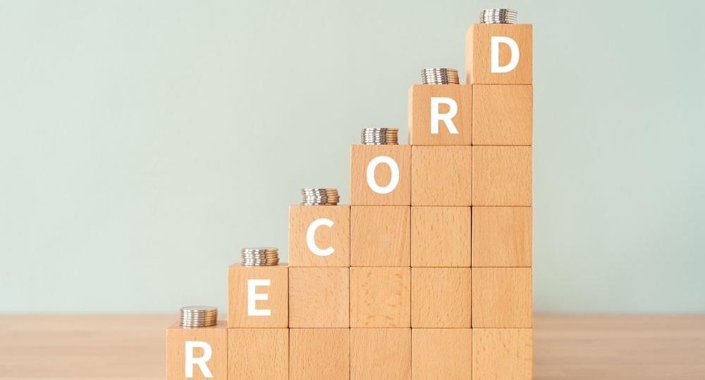 Wooden,Blocks,With,"record",Text,Of,Concept,And,Coins.