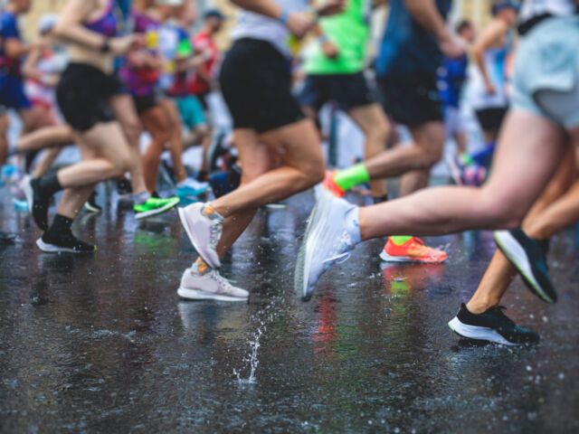 Marathon,Runners,Competition,In,The,Rain,Close-up,,View,Of,Footwear