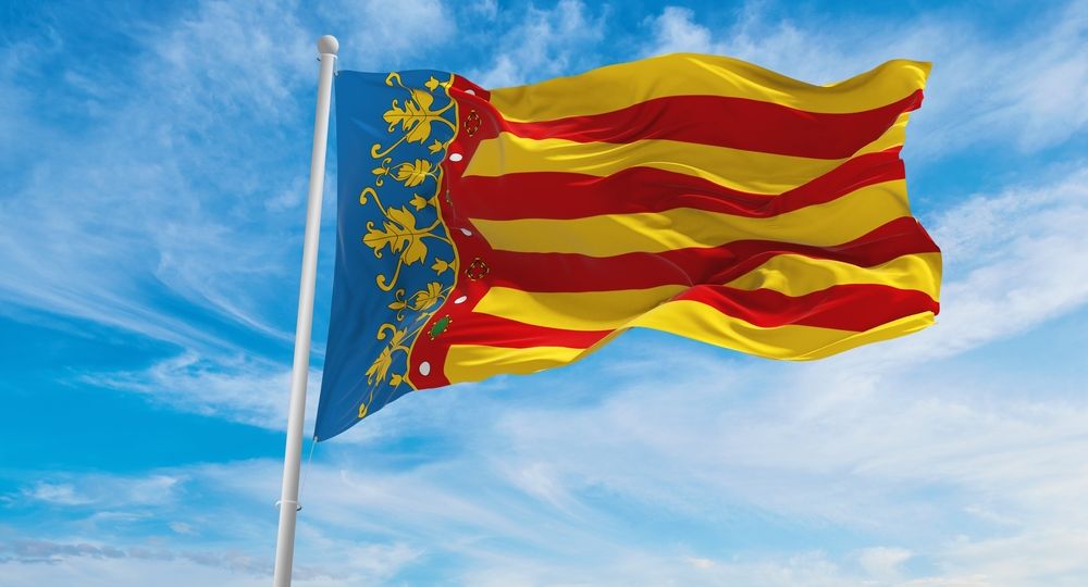 Flag,Of,Valencian,Community,,,Spain,At,Cloudy,Sky,Background