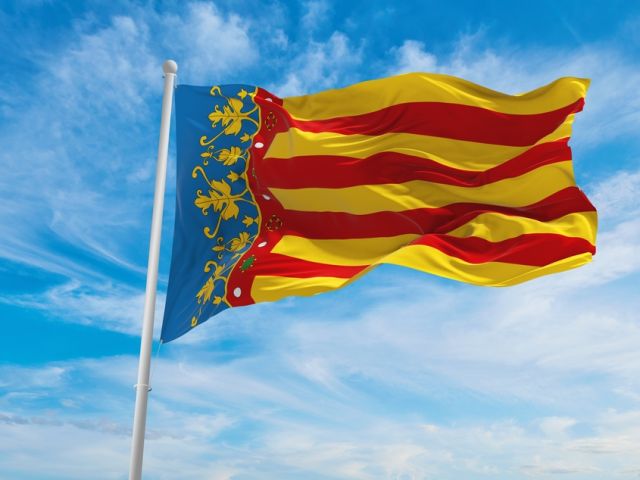 Flag,Of,Valencian,Community,,,Spain,At,Cloudy,Sky,Background